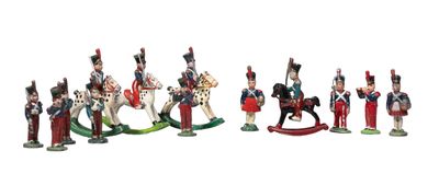 a group of figurines of soldiers on a white background