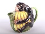 un singe assis à l'intérieur d'une tasse