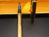 a pen that is sitting in a box with a pen in it