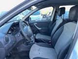 the interior of a car with a steering wheel and a dashboard