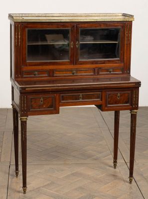 an image of a wooden desk with a glass door on top
