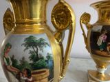two vases that have pictures on them on them