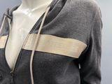 a mannequin wearing a grey jacket with a beige zipper