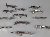 a lot of silver animal figurines on a table
