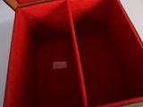 a red box that has three compartments inside of it