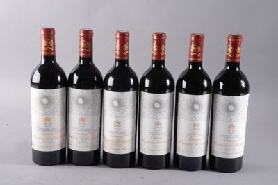 six bottles of wine lined up in a row on a table