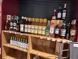 many bottles of alcohol on the shelves in the store