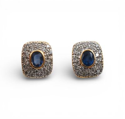 a pair of sapphire and diamond earrings