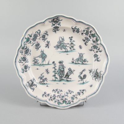 an image of a blue and white plate with birds and flowers on it