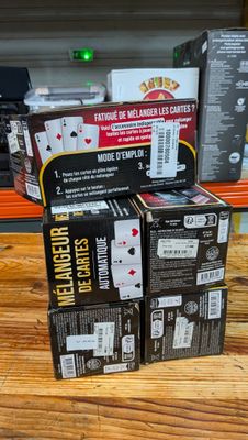 boxes of playing cards on a wooden table in a store