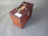 a small wooden box that has a label on it