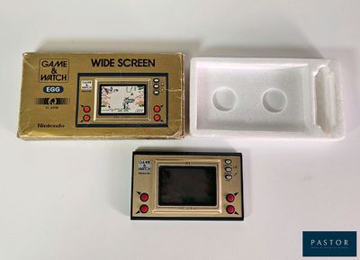 a small electronic device that is sitting next to a box