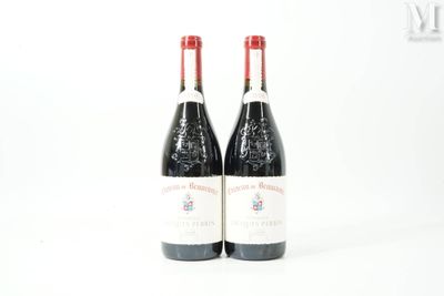 two bottles of wine sitting next to each other on a table