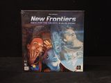 a box of new frontiers on a black surface