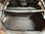 a trunk of a car with the back seats folded down
