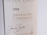 a bottle of wine with a signature on the label