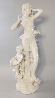 a statue of a woman with a child on her lap
