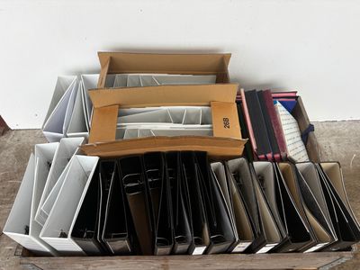 a lot of folders in a box on the floor