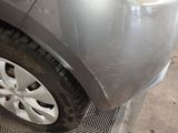 a close up of a car ' s tire on the side of the road