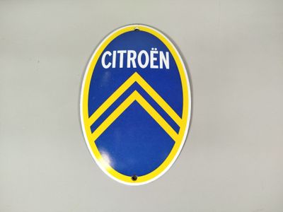 un panneau bleu et jaune sur lequel est inscrit « Citroën »