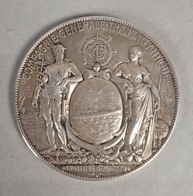 une pièce d'argent sur laquelle figurent des armoiries