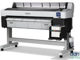 a large format printer on a stand with a roll of ink