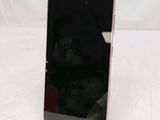 a cell phone that is sitting on top of a stand