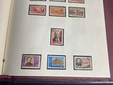 a book with stamps on it sitting on a table