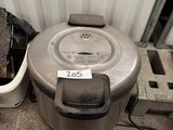 a trash can sitting next to a trash can and a trash can