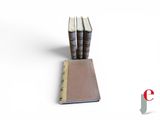 three books sitting on top of each other on a table