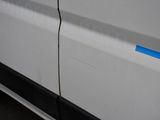 a white van with a blue stripe on the side of it
