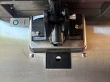 a close up of a machine with a button on it