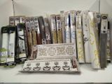 a lot of different types of fabric on a shelf