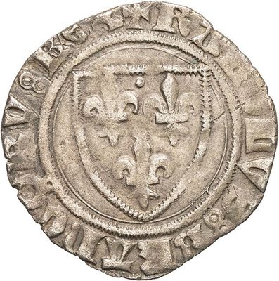 a close up of a coin with a coat of arms on it