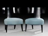 pair of black and blue chairs with blue upholstered cushions