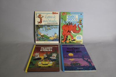 trois livres pour enfants sont alignés sur une table