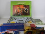 a toy truck and a box of toys on a table