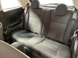 the back seats of a car are black and grey in color