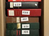boxes of books are stacked on top of each other in a box