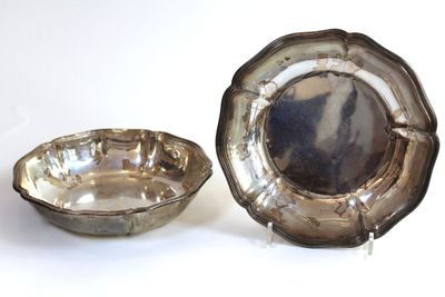 a silver plate and a silver bowl on a white surface