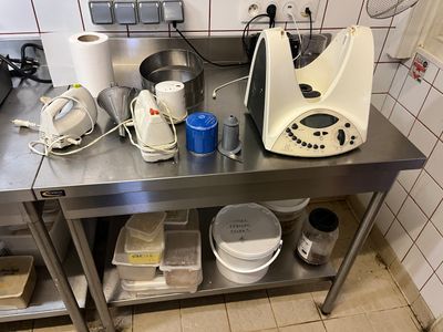 a kitchen counter with a blender and other items on it