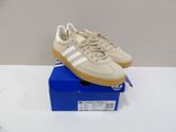 a pair of adidas sneakers are on a blue box