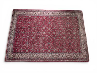 a red rug on a white surface with a white background