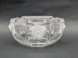 an image of a clear glass bowl with a statue in the center