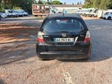 a black car that is parked in a parking lot