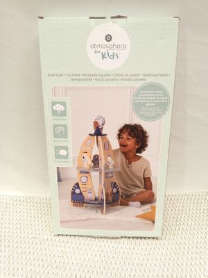 the box is open to show the contents of the doll house
