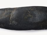 a rock that has been placed on a white surface
