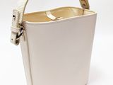 a white bucket bag with a handle on a white background