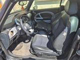 a picture of a small car with the front seats down