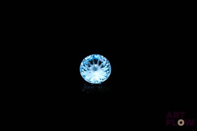 a close up of a blue diamond on a black background